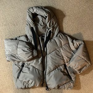Tan puffer jacket with hood.
